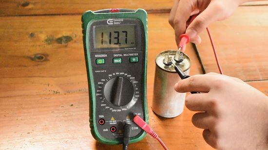 testing an ac  capacitor with a multimeter image
