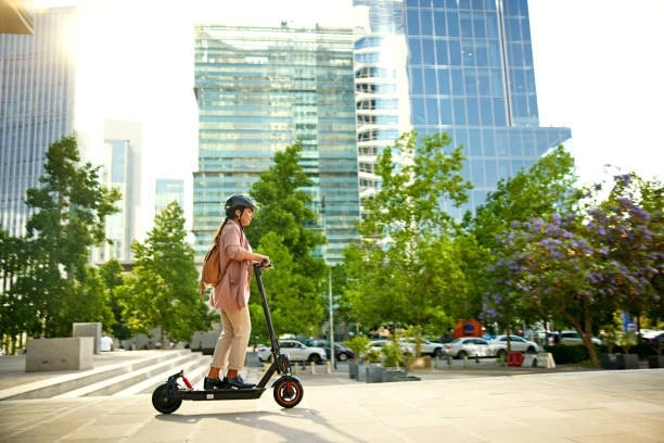 Women Riding Electric Scooters 